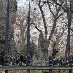 Park with fence made of bayonets and cannons.