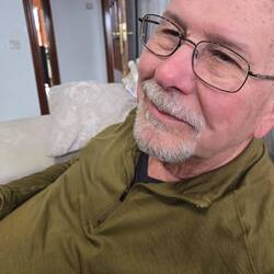 Phil with even less hair than usual and a trimmed beard.