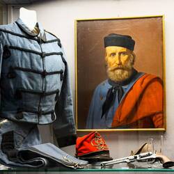 Uniform of the Garibaldine Guides w/red forage cap; anonymous portrait of Garibaldi.