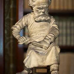 The study ... plaster caricature of Carducci in the act of polishing the "Italian boot."