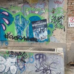 Look at the sign on right corner. It means if you piss on the wall, your video will be on a YouTube.
