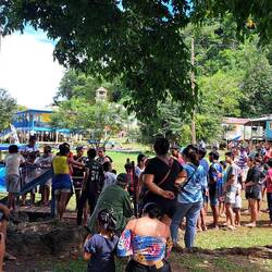 The line of children waiting for passengers to disembark the tender.