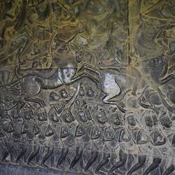 A bas relief - rising a horse drawn carriage into battle