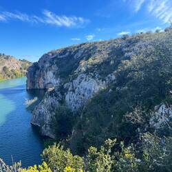 Signs pointed to via ferrata route somewhere on this cliff.