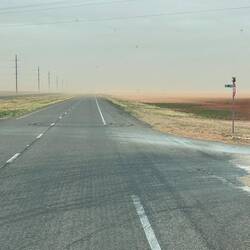 Sand blowing across the road
