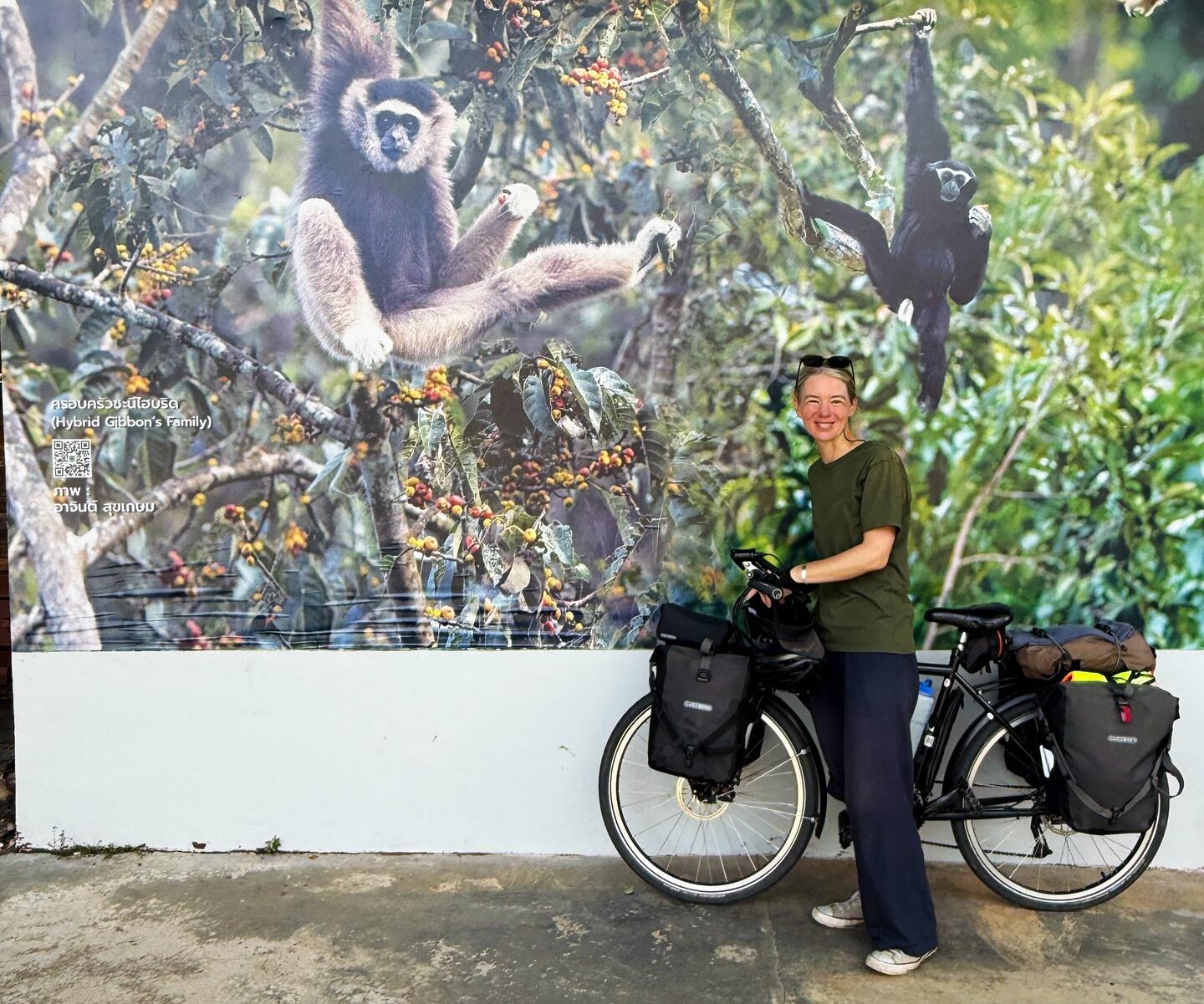 Amanda at Khao Yai NP visitor centre with a photo of the two gibbon species. Will we see them?!