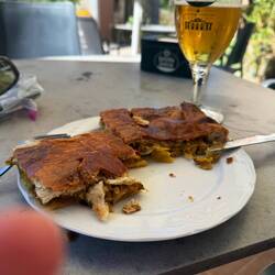 Post walking lunch-- tuna empanada and an Estrella Galicia. The best !