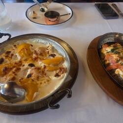 Chicken cooked in Wellou cheese and peaches, eggplant with sheep cheese and grilled karvolo cheese