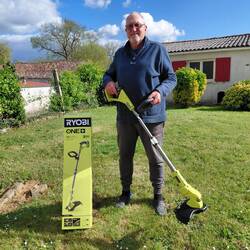 Roger with 'Wally' the whipper snipper, about to get to work