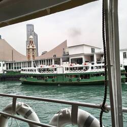 Traditional green and white ferry.