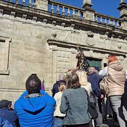 Mary descends the steps with her bearers.