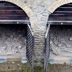 Boat houses on what was the shore, where skeletons were found