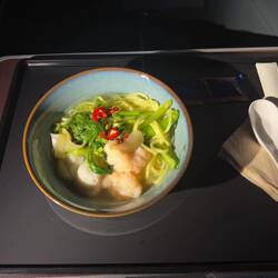 Midflight noodle snack on CX292. The shrimp and squid balls were poor quality.