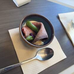 Amuse bouche on CX292 consisting of beef, asparagus, and mushroom in a cream sauce.