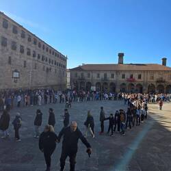 The crowd is in line to enter the church for mass.