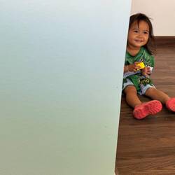 Cute levels for kids in SE Asia is off the scale. Playing peek-a-boo which happily is universal.
