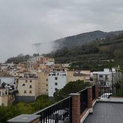 The clouds have moved up to Soportújar. The church is still visible though.