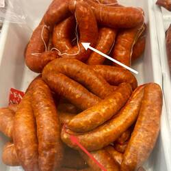 White connecting string = mild; red connecting string = spicy, per the shopkeeper