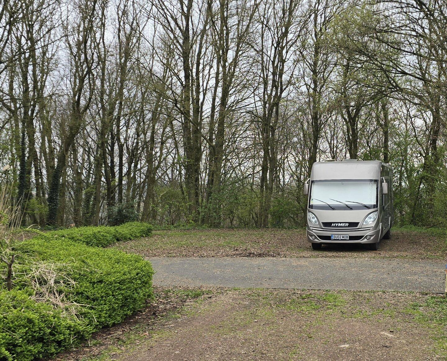 Big parking spaces in a forest setting at the motorhome aire