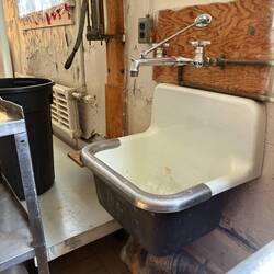 A very low sink that the junior girls used to wash things in