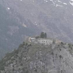 A building that appears unused up in top of the mountain.