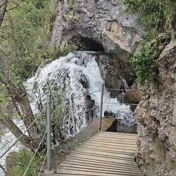 Water comes out of the lower cave and feeds the mill race