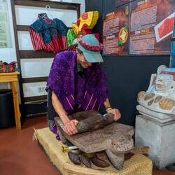 Me grinding cacao beans