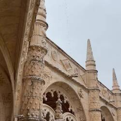 Gargoyle gushing rainwater at Jeronimos