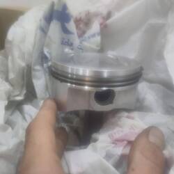 Fitting the piston with it's rings...