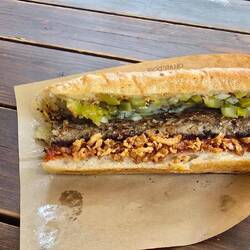 Japanese hotdog. Mixture of pork and beef and great seasoning.