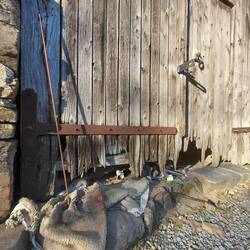 The junk is gradually making its way under the old timber doors