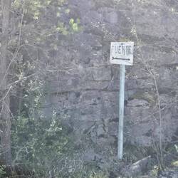 The sign is to a water fountain on the Camino route.