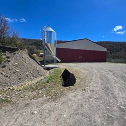A farm at the top of the hill.