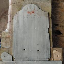Just some of the bullet holes in an old WW1 memorial plaque in the church