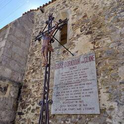 A memorial on the wall of the church to the women and children of Oradour-sur-Glane