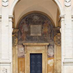 On the lower arcaded loggia — Palazzo dell'Archiginnasio.