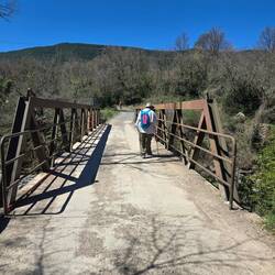Walking across the train bridge.