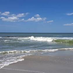 High tide: there's a large coral structure under all those waves.