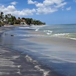 Long view of beach; sideview of the riptide.