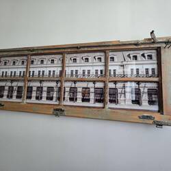 They took an old window from the original ruined train station and made it into a picture frame.