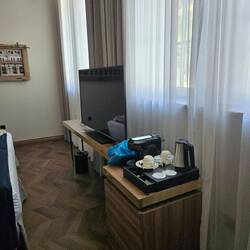 A big TV and coffee set up.