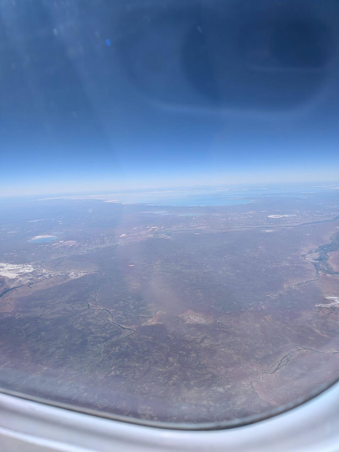 View from my window on the plane. There's water in the distance.