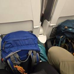 Packs ready to get off at a quick stop.