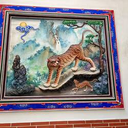 This is in another temple. The painting is actually 3-D with the male tiger's heaď extending
