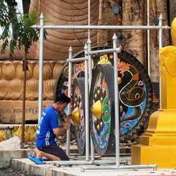 Man at the prayer gong