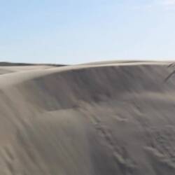Sand surfing. Filmed under challenging circumstances.