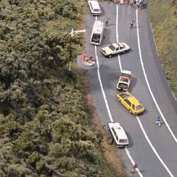 Accident scene, with guy giving cpr