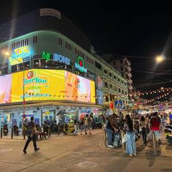 As night falls the streets become alive with lights, night markets, and people thronging the streets