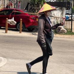 Balancing act (not sure what are in the bags)