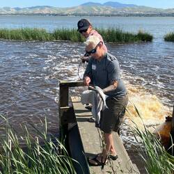 Laurel and Stacey catching a Striper.